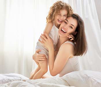 Happy mother holding her child